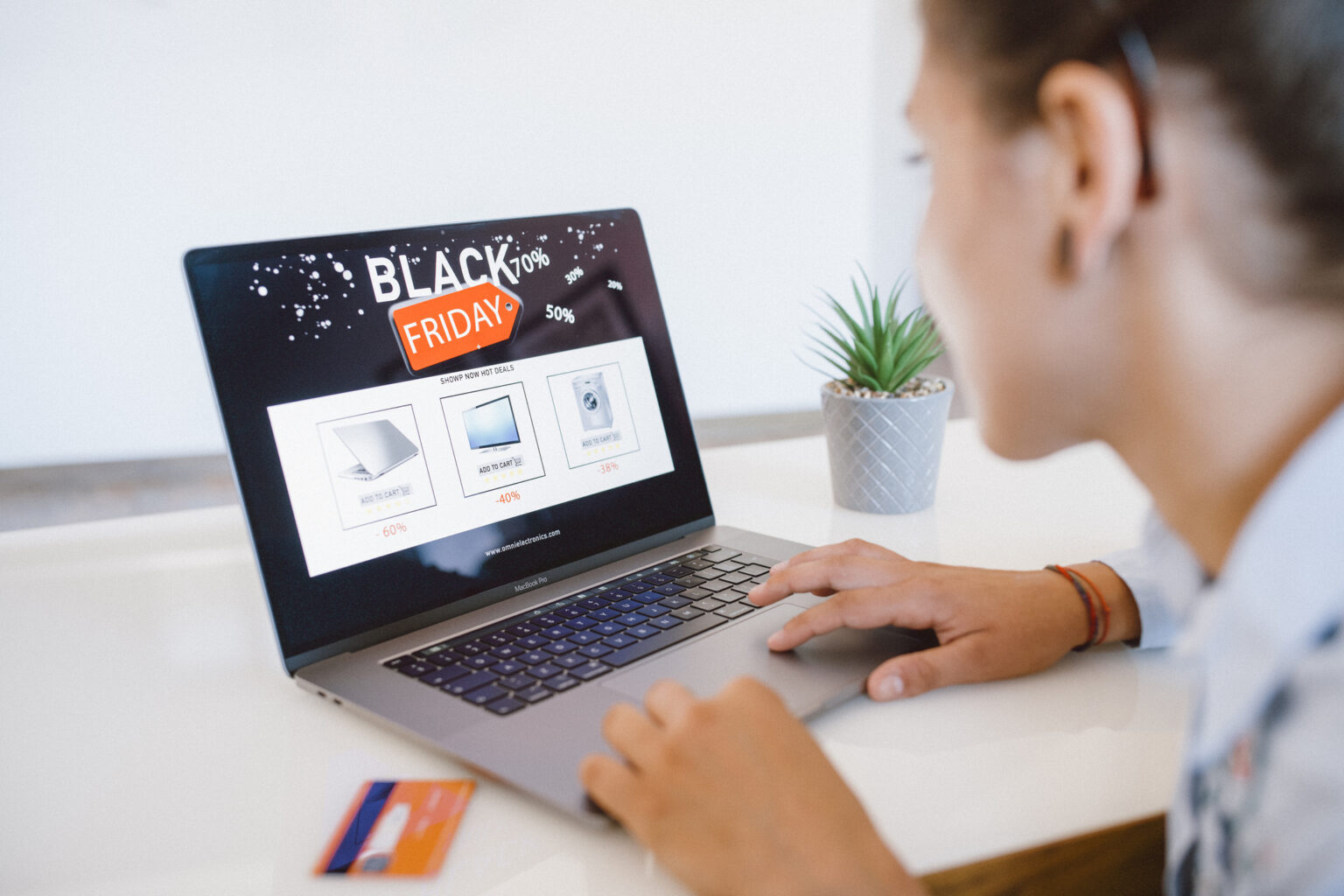 Woman Is Shopping Electronics Online At Black Friday Woman is shopping electronics at Black Friday discounts