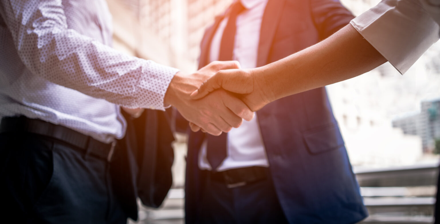 handshake of business People Colleagues Teamwork Meeting .Hold hand and shake hand in city