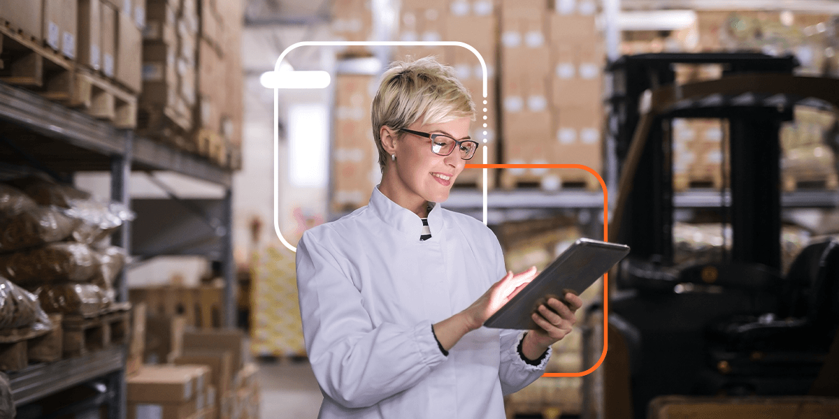 person using a tablet in a warehouse