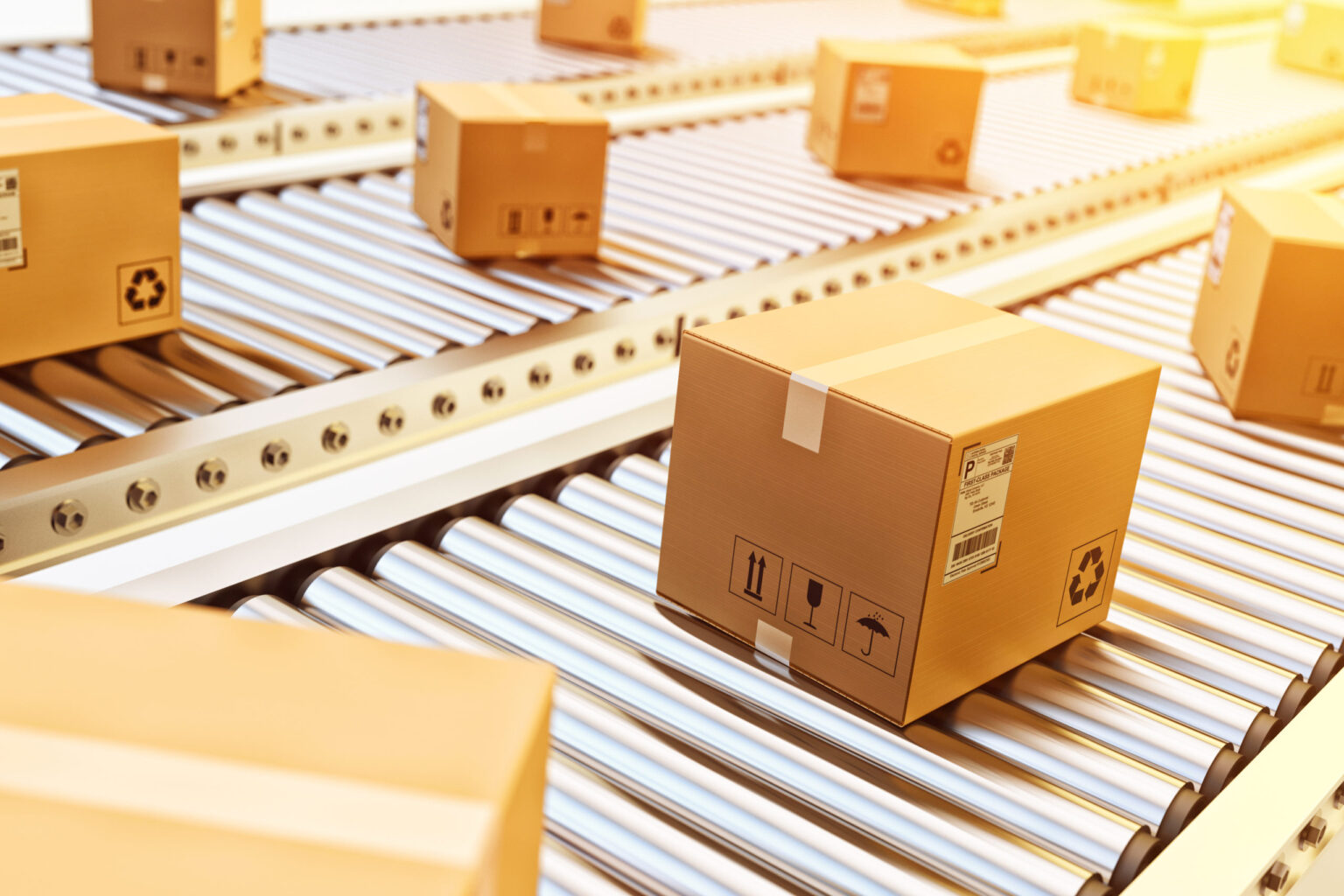 Cardboard boxes on conveyor belt in warehouse