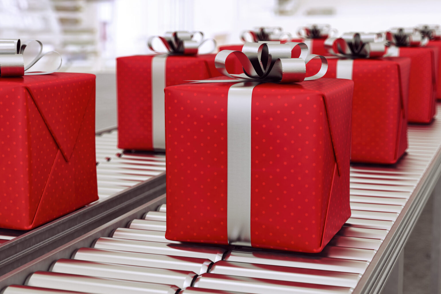 Red gift boxes on conveyor belt in time for christmas