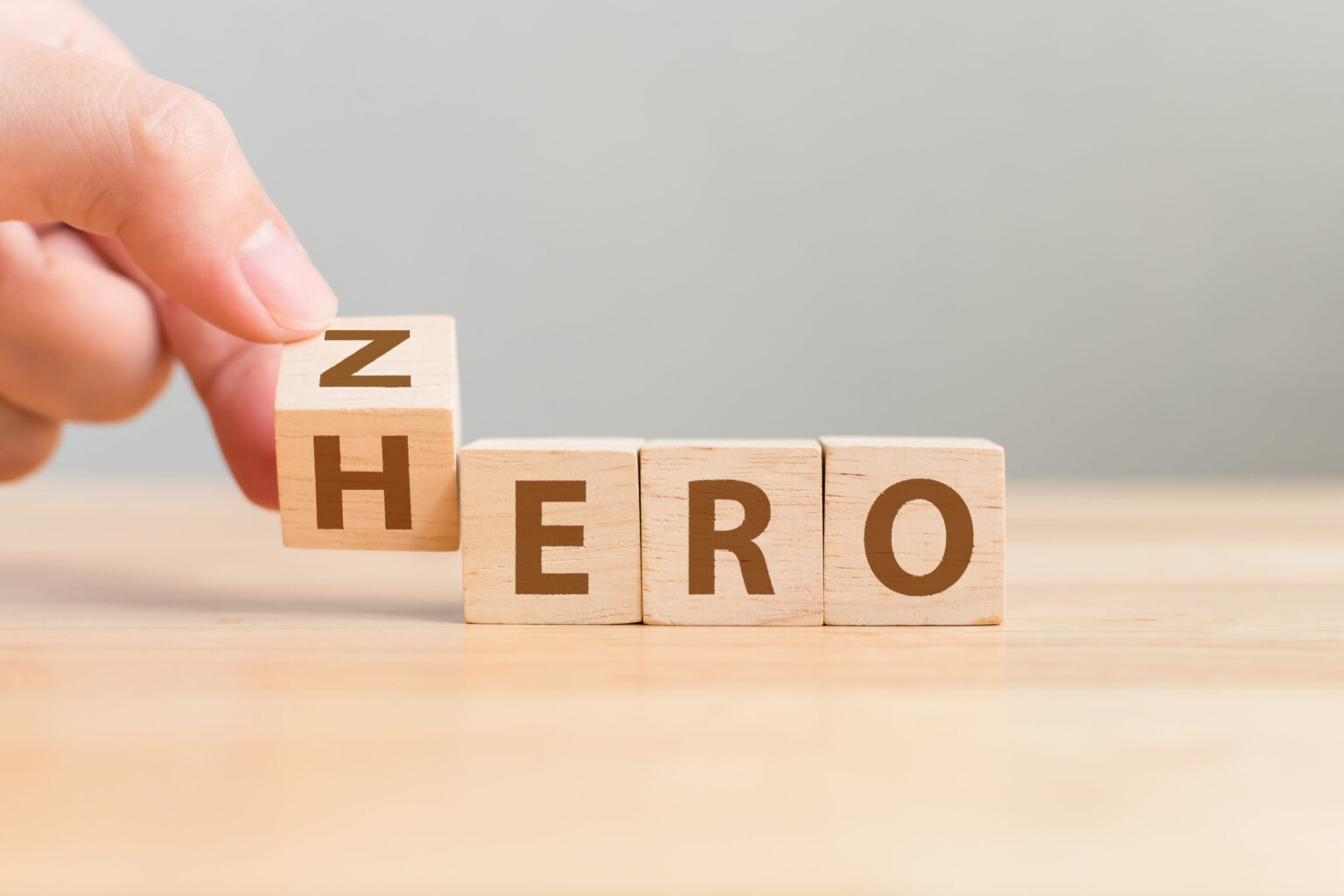 Zero or Hero concept, Hand flip wood cube change the word