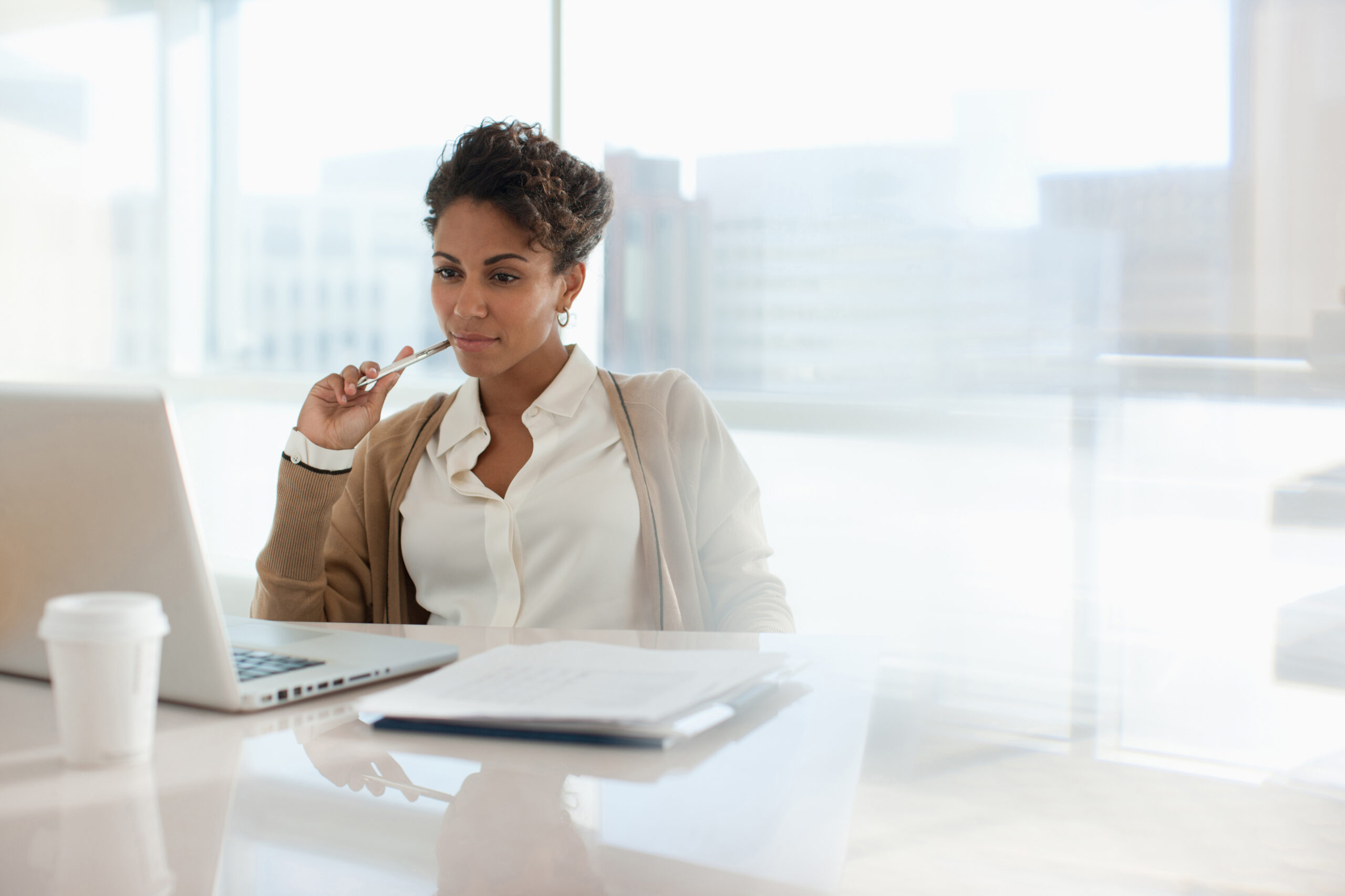 Businesswoman using laptop in office