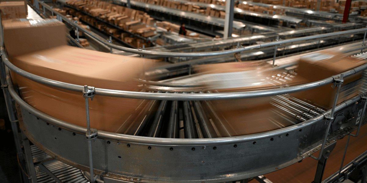 packages zooming past on a conveyor belt