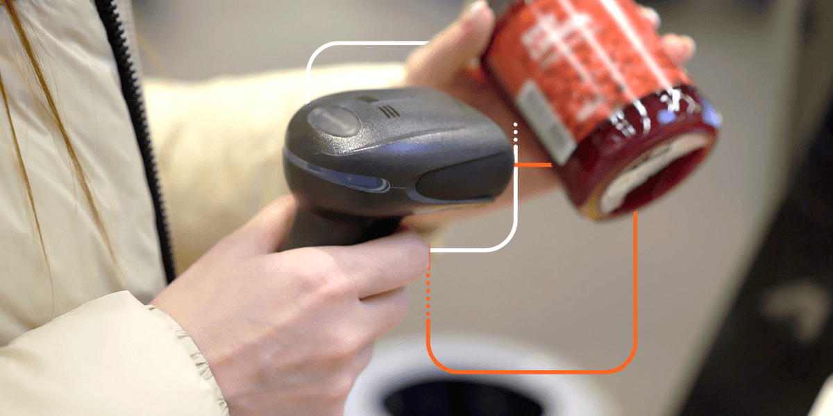 person scanning a jelly jar