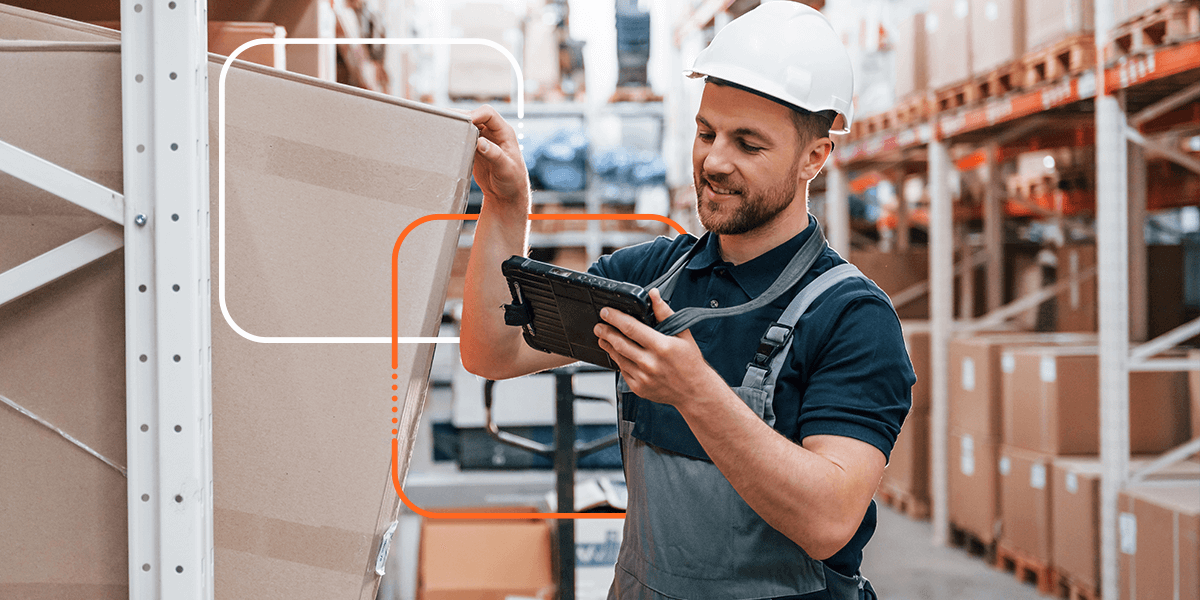 person selecting a product in a warehouse while using a tablet